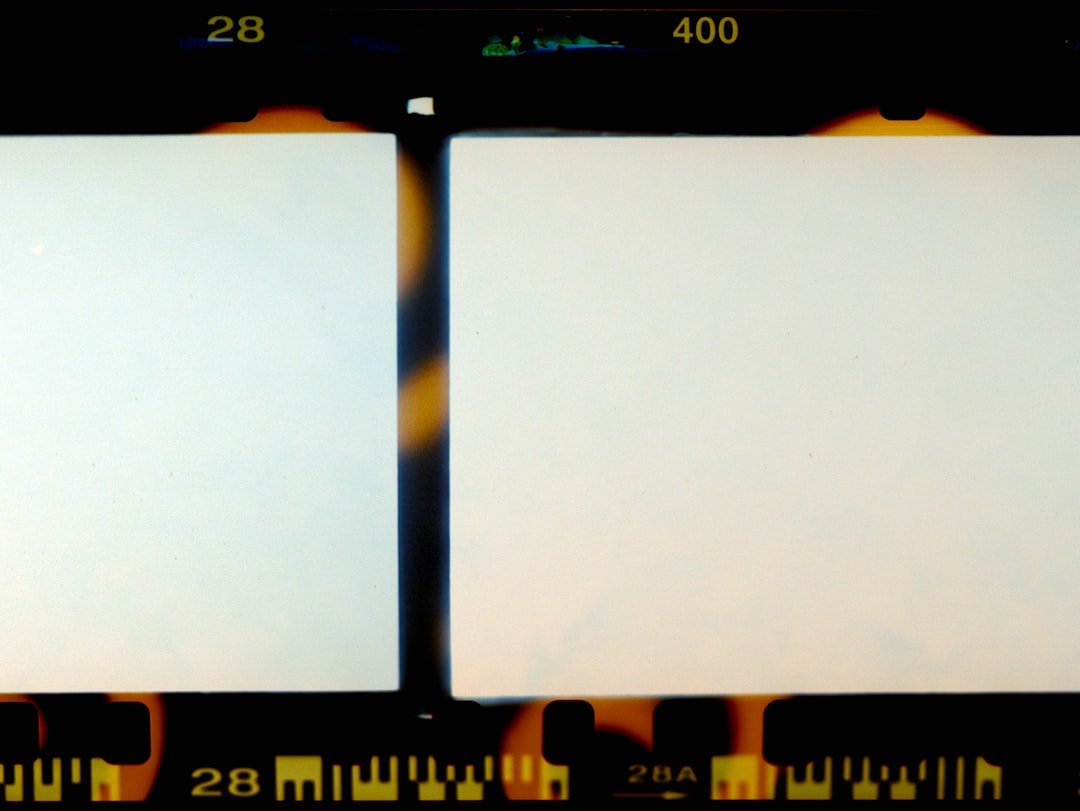 Camera LCD screen showing manual mode settings with ISO, aperture, and shutter speed controls highlighted