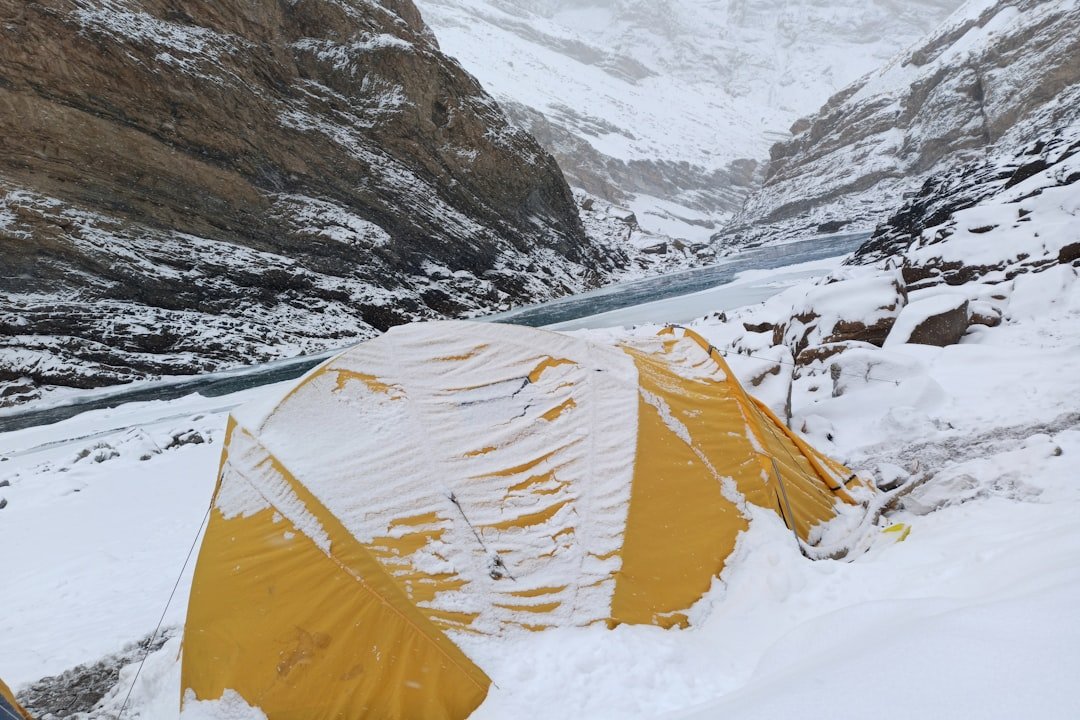Expedition sleeping bag set up inside Arctic tent with frost visible